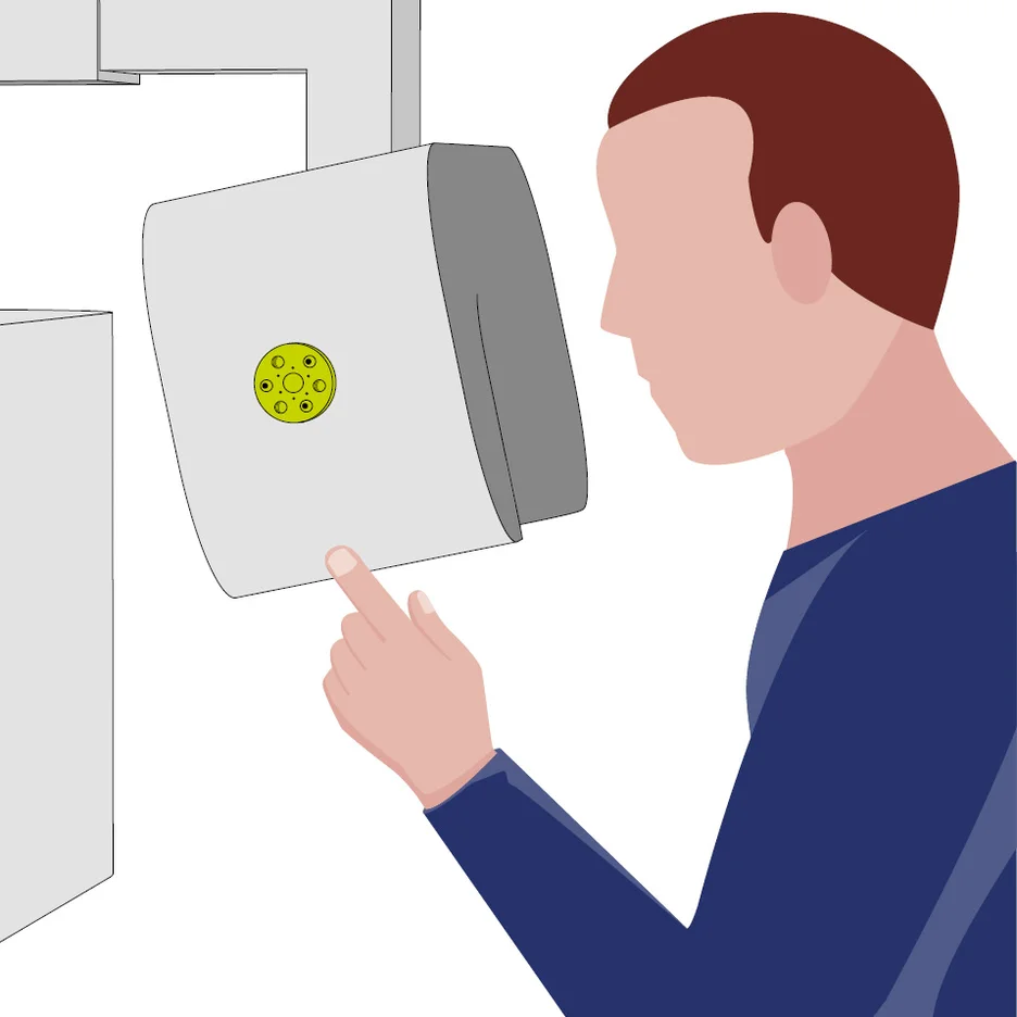 Operator observing display interface of robotic system while interacting with control setup