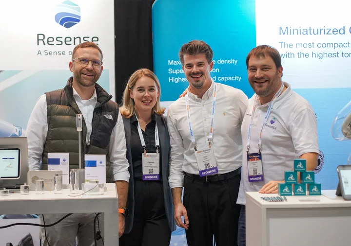 Resense team at trade fair booth showcasing miniature force torque sensors and products